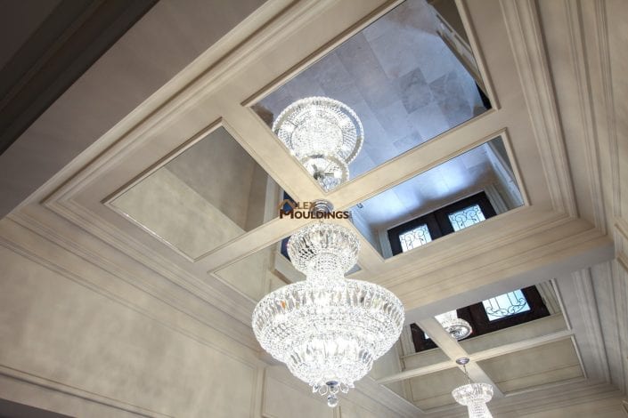 coffered ceiling with mirrors and cahndalier